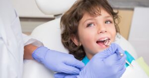 Young boy smiling at dentist office