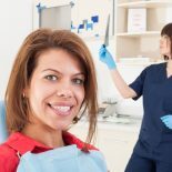 Woman smiling at dentist office